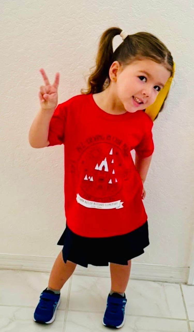 Student wearing a red NBB spirit shirt